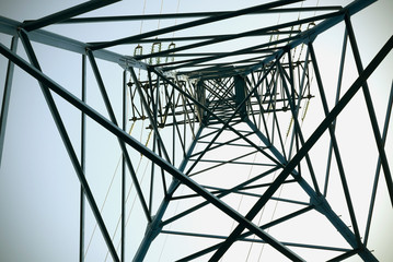 Electricity pole with a blue sky on background. Electricity pylon.