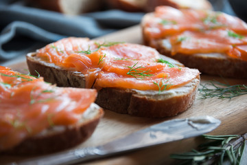 Sandwithes with smoked salmon and creamy cheese on bread