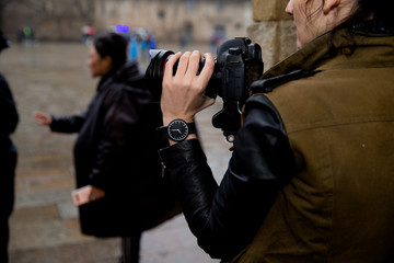 Photographer working with watch