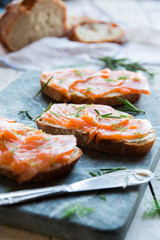 Sandwithes with smoked salmon and creamy cheese on bread