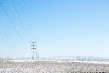 Winter industrial landscape high-voltage lines