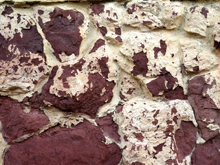 Old walls of buildings, aged texture and background. Cracked paint and stucco