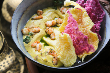 Homemade hummus with shrimps and rice chips