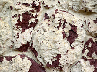 Old walls of buildings, aged texture and background. Cracked paint and stucco