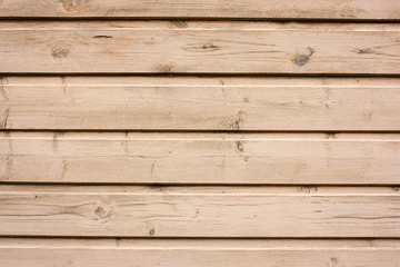 wooden wall of light unpainted boards