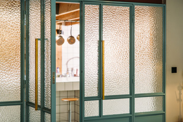 door and window of a midcentury modern loft style kitchen