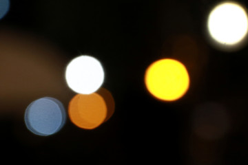 Fototapeta premium Abstract blurred circle bokeh lights backgrounds, Colorful bokeh of city night light