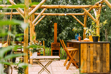 Fototapeta na wymiar Outdoor wooden terrace with a cocktial bar