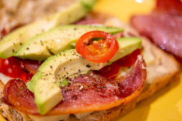 Bacon, avocado, cheese and tomato sandwich