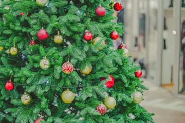 Fototapeta na wymiar Nice Christmas tree with decorations close up