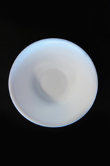 Variety of cold cereals in white bowls, quick breakfast for kids overhead shot with copyspace