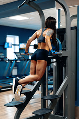 Fototapeta na wymiar Sporty woman working out in a gym