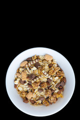 Variety of cold cereals in white bowls, quick breakfast for kids overhead shot with copyspace