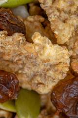 Variety of cold cereals in white bowls, quick breakfast for kids overhead shot with copyspace