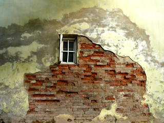 Old cracked wall with a window