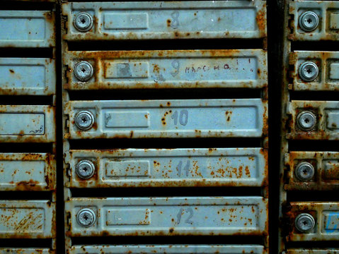 Old mailboxes in an apartment building. Rust and texture