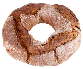 Rye-wheat bread in a ring form with sunflower seeds isolated on a white background