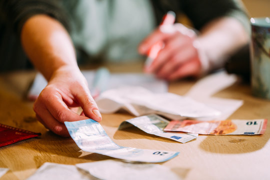 Woman Counting Money With Bills And Euro's