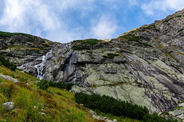Zlota Siklawa (golden waterfall) - waterfall on the glacial threshold (Zlote Spady, Jazerna stena) in the Valley of Five Ponds Spiskie (Dolina Pieciu Stawow Spiskich, kotlina Piatich Spisskych plies).