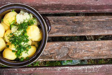 pan of boiled young potatoes with dill