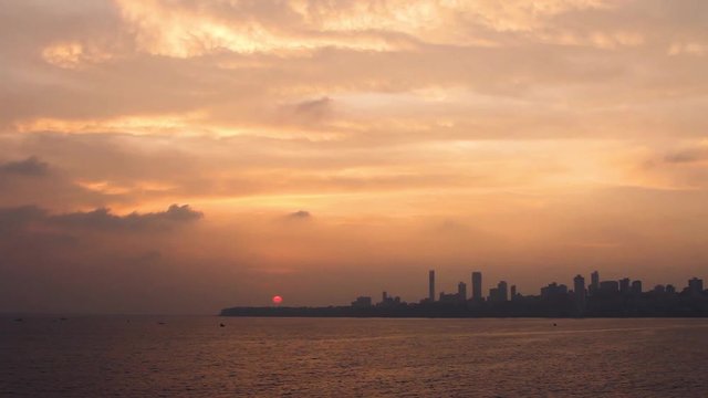 Real Time Wide Angle footage of Mumbai's Skyline with a Beautiful Sunset in the background, taken from Marine Drive. 1643.