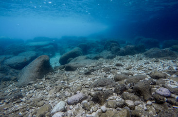 Rock underwater on the seabed in the Mediterranean sea, natural scene. Underwater photography.