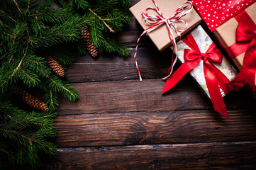 Christmas card close-up, fir tree with cones and gifts