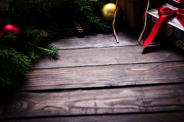 Christmas card close-up, fir tree with cones and gifts.