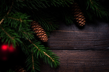 Christmas card close-up, fir tree with cones and gifts.