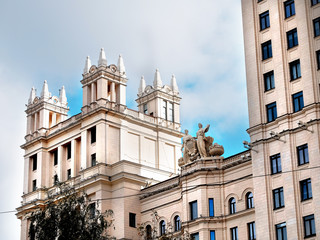 The upper floors of a high-rise apartment building in the center of Moscow, Russia, a sculpture on the roof closeup