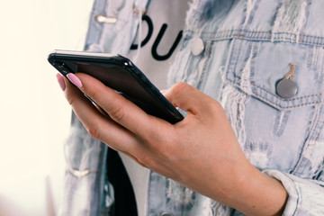 girl holding a phone in her hand