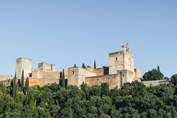 Fototapeta na wymiar View of the Alhambra Palace from the Carvajales viewpoint. Blue sky for copy space or collage