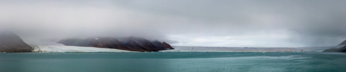 Panorama of a glacier and mountains in Ellesmere Island, part of the Qikiqtaaluk Region in the Canadian territory of Nunavut.