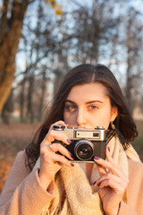 girl takes off on a vintage film camera