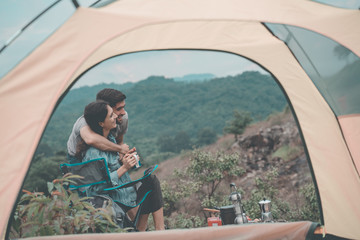 Couple hiker in the mountains, group of friends hiking climbing mountain nature landscape. lifestyle man journey and team adventure giving help or support. winner team for success together.