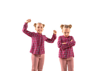 Young handsome girl arguing with herself on white studio background. Concept of human emotions,...