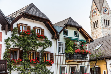 Fototapeta na wymiar Hallstadt, Austria - July, 2019: Beautiful houses of Hallstadt, Austria. Tourist destinations.
