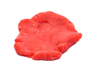 Red modelling clay, plasticine isolated on white background