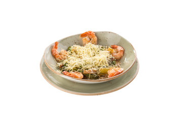 Healthy Grilled Caesar Salad with shrimp, parmesan Cheese and Croutons on grey plate isolated on white background