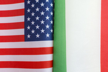 national flags of the USA and Italy close up concept