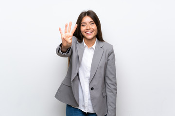 Young business woman over isolated white background happy and counting four with fingers