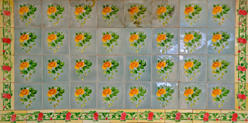 Fototapeta na wymiar Blue Pernanakan tiles with yellow roses