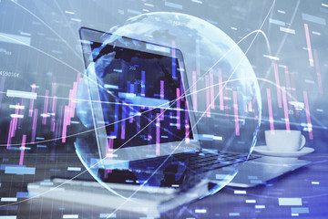 Financial graph colorful drawing and table with computer on background. Double exposure. Concept of international markets.