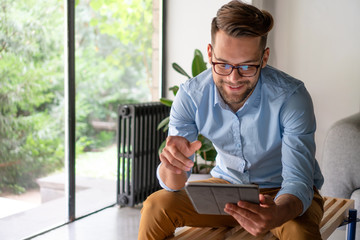 Young Man looking at digital tablet