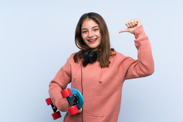 Young skater girl over isolated background