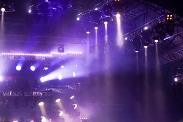 Purple light on a rock concert stage as background