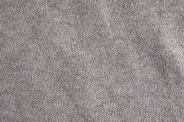 Fototapeta na wymiar Grey knitted sweater as background, closeup view