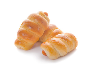 Fresh hot crusty bread rolls. Sausages in dough