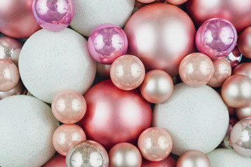 Top view of various pink and white Christmas tree ornament  baubles