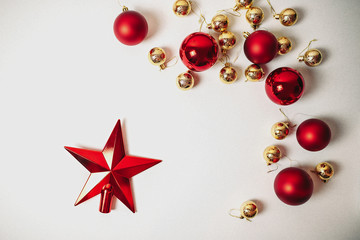 Christmas ornaments on the white background isolated. Red and golden christmas balls. Red star on the white.